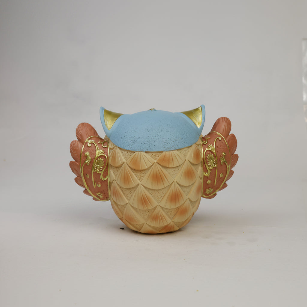 Decorative owl figurine - back view with teal and gold ear tufts