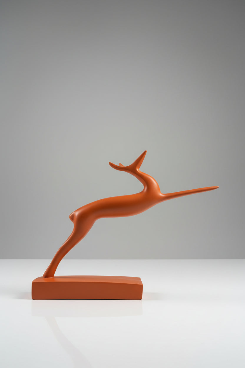 Abstract leaping gazelle sculpture in terracotta matte finish on matching base