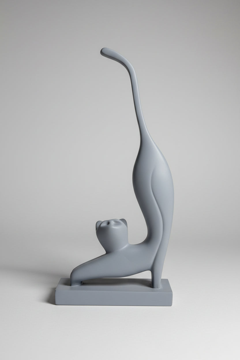 Abstract stretching cat sculpture in grey matte finish on matching base